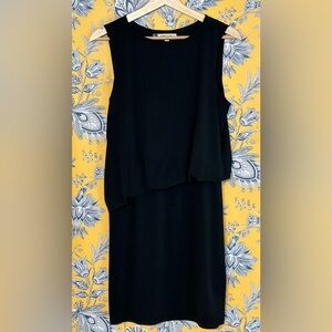 JENNIFER LOPEZ S black sleeveless dress with funky waistline and fun style—EUC